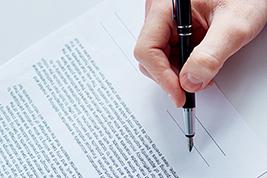IMAGE: Person signing contract
