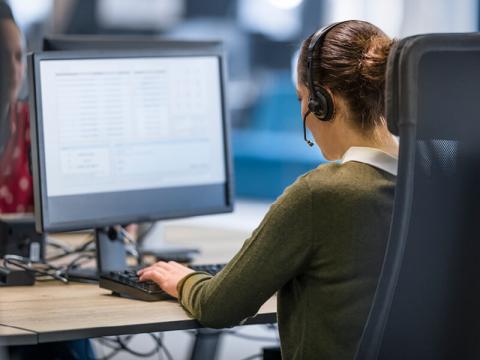 IMAGE: Woman at computer desk