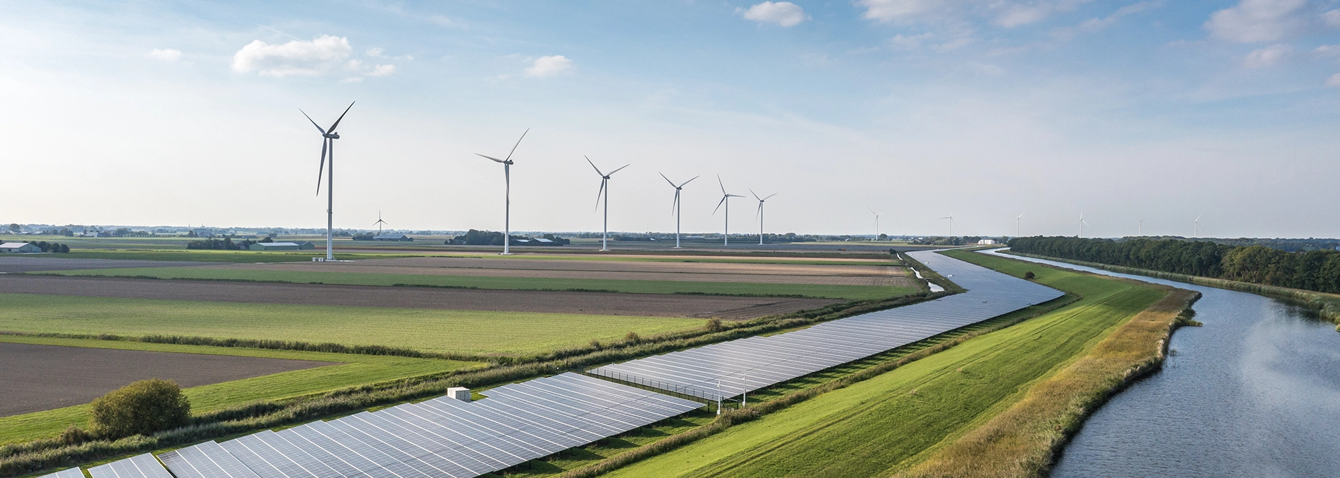 Bracewell Infrastructure Development practice banner image, which shows windmills on a green landscape.