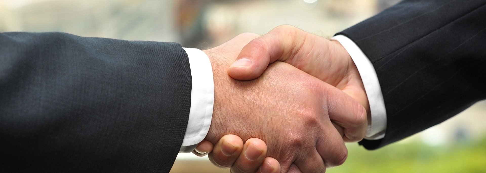 Bracewell Antitrust practice banner image, which shows a handshake.