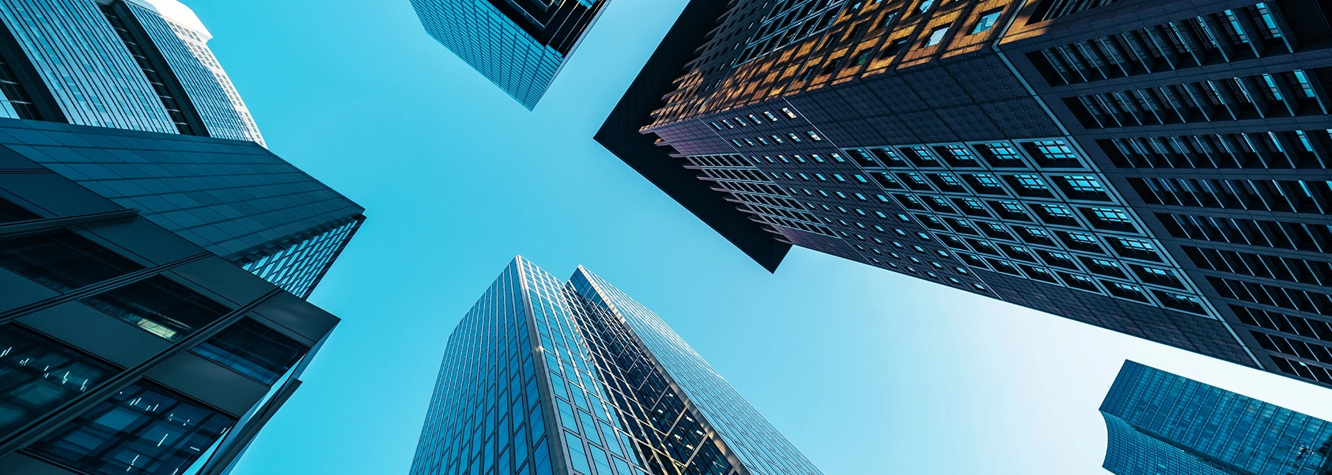 Bracewell Corporate & Securities practice banner image, which shows several office buildings under a blue sky.