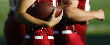 Player holding a football